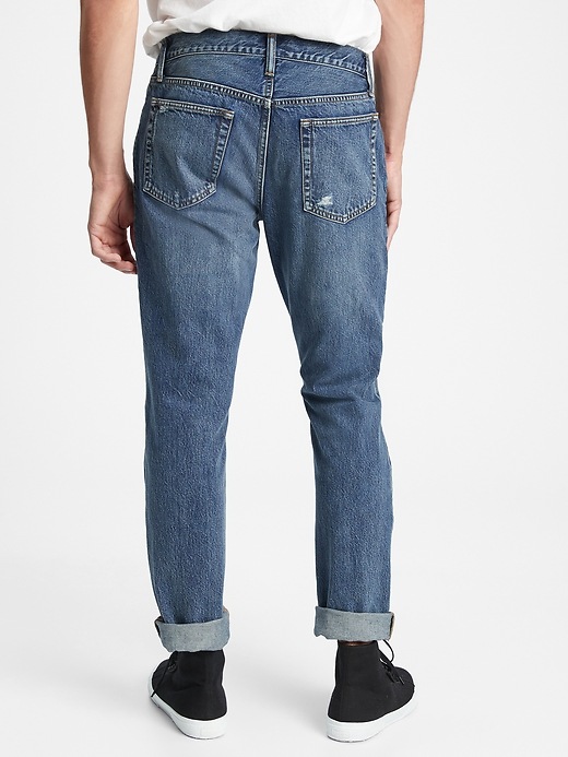 View large product image 2 of 3. Mid Rise Distressed Slim Jeans