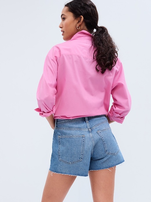 2 of 8 showing, with the color medium wash of product 4" Mid Rise Distressed Stride Shorts