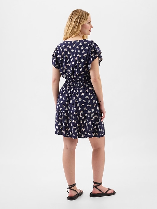 Image number 4 showing, Smocked Flutter Sleeve Mini Dress