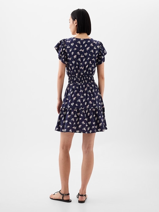 Image number 2 showing, Smocked Flutter Sleeve Mini Dress
