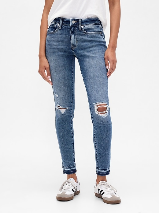 Image number 2 showing, Mid Rise Destructed Universal Skinny Jeans